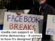 A protester calls out Facebook for facilitating the spread of disinformation. AP Photo/Jeff Chiu